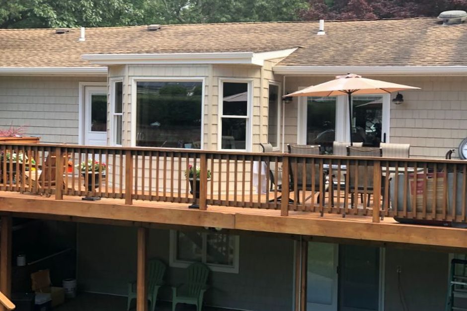 South Shore Long Island house with living space below the main floor and a raised rear deck, Just Enterprise One Corp.