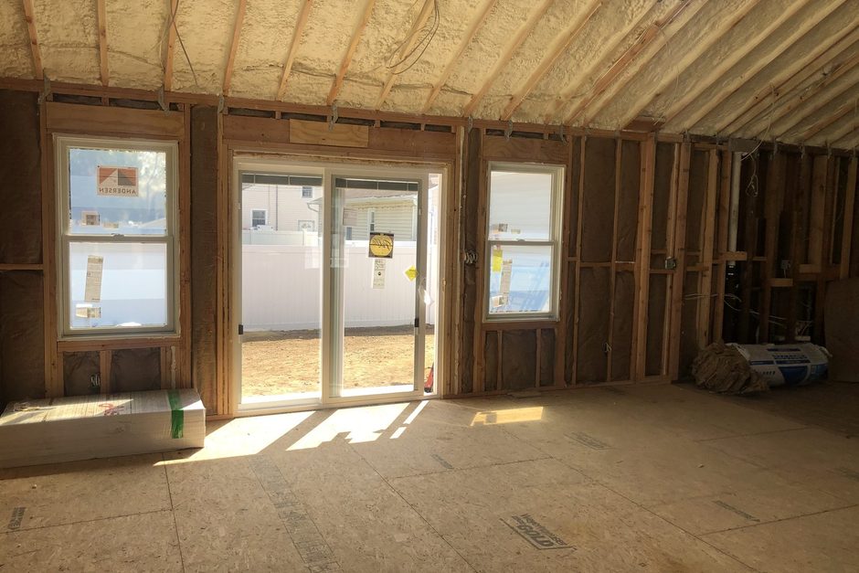 Open stud framing and wiring inside a Long Island home addition, Just Enterprise One Corp.