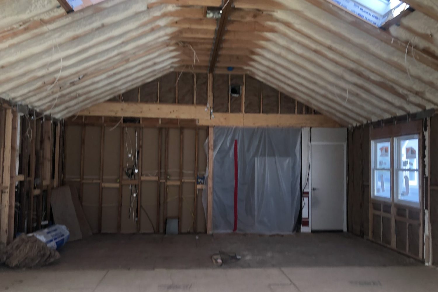 Mid-renovation interior with a poly dust barrier on a Long Island home — Just Enterprise One Corp.