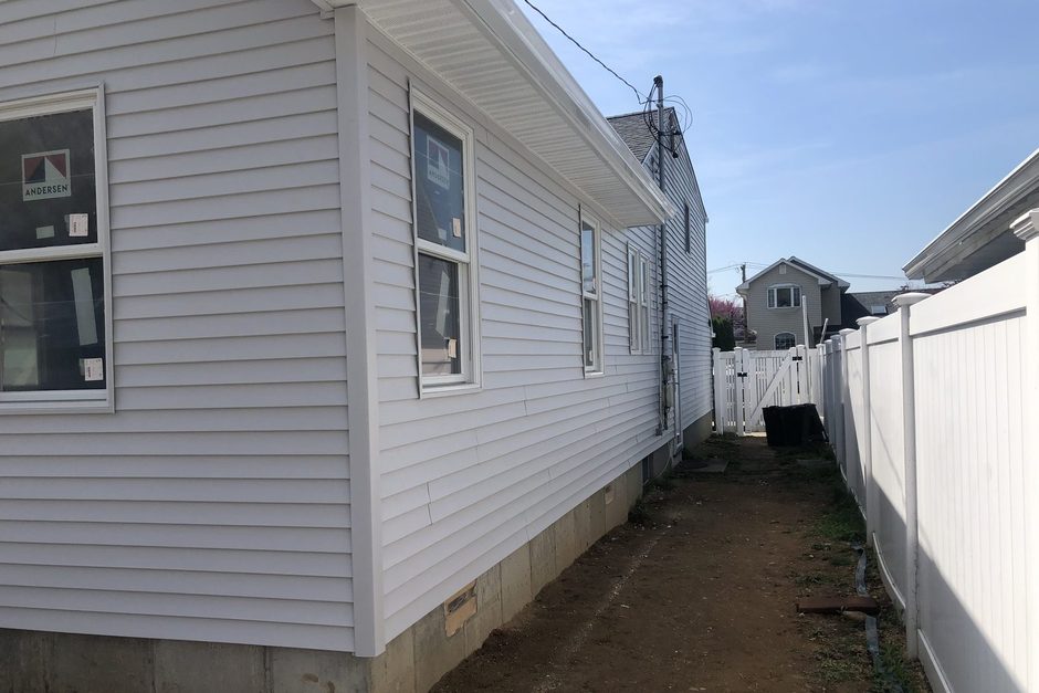 New seamless gutter, soffit and fascia along the eave of a Long Island house. Just Enterprise One Corp.