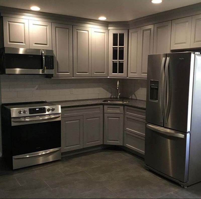 Gray cabinets with stainless appliances — Islip, NY