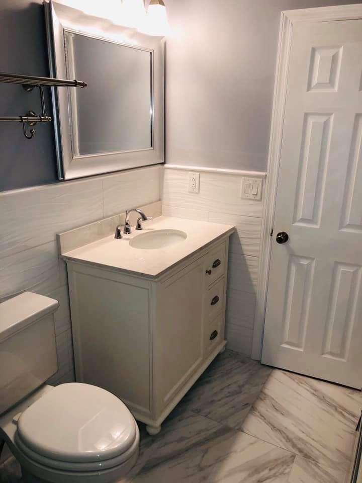 Small white vanity bathroom remodel with new fixtures