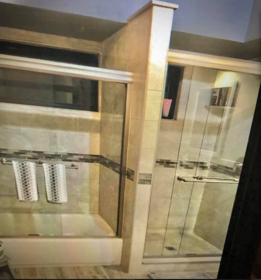 Elegant dual walk-in shower with floor-to-ceiling tile