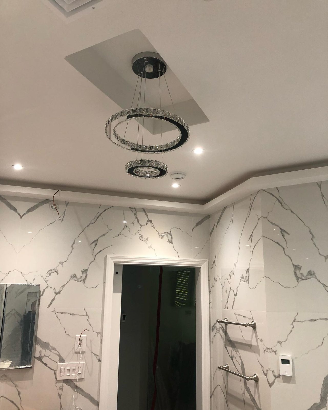 Luxury marble bathroom remodel with freestanding soaking tub