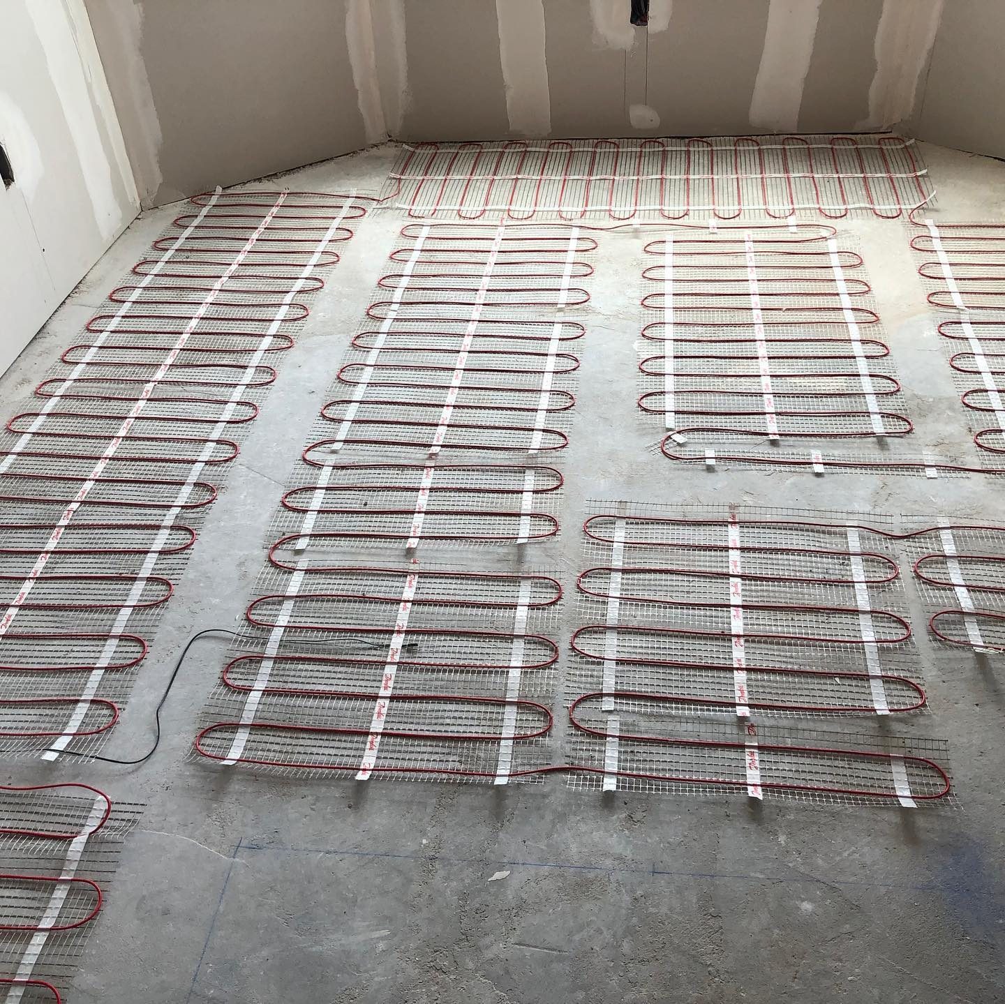 Radiant heat mat installed under tile flooring