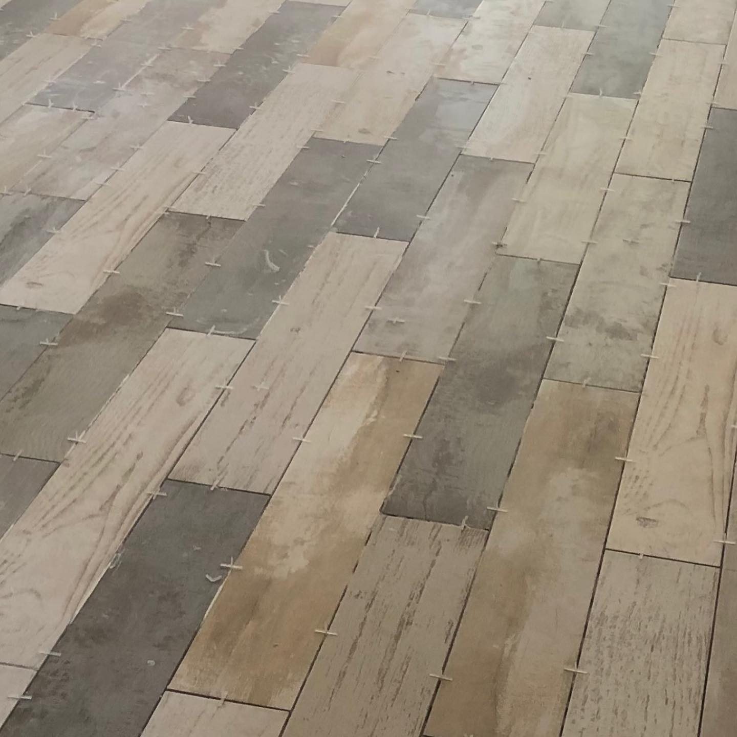 Close-up of wood-look tile pattern and grout detail