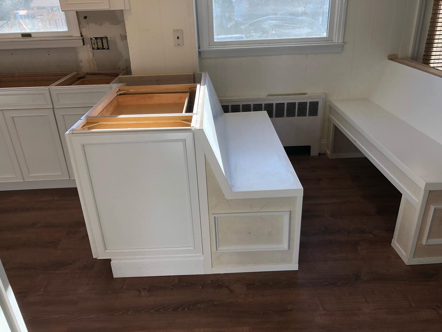 Cream shaker cabinets with granite countertops — finished kitchen