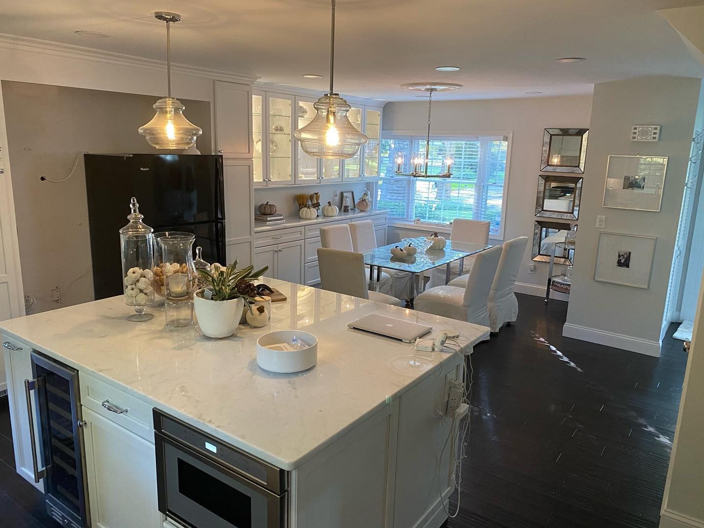 White kitchen remodel with stainless appliances and subway tile