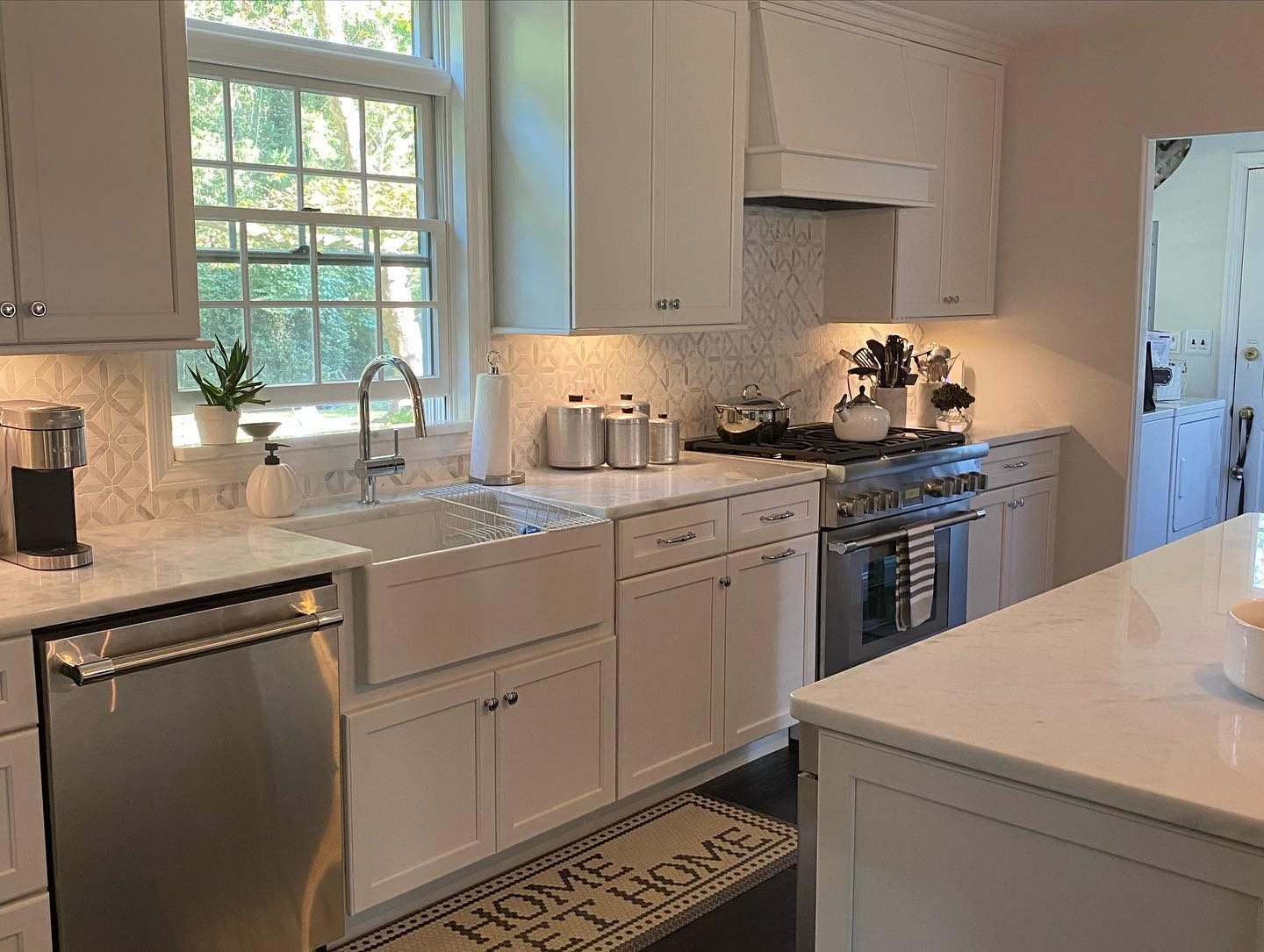 White shaker kitchen detail — crown molding and hardware