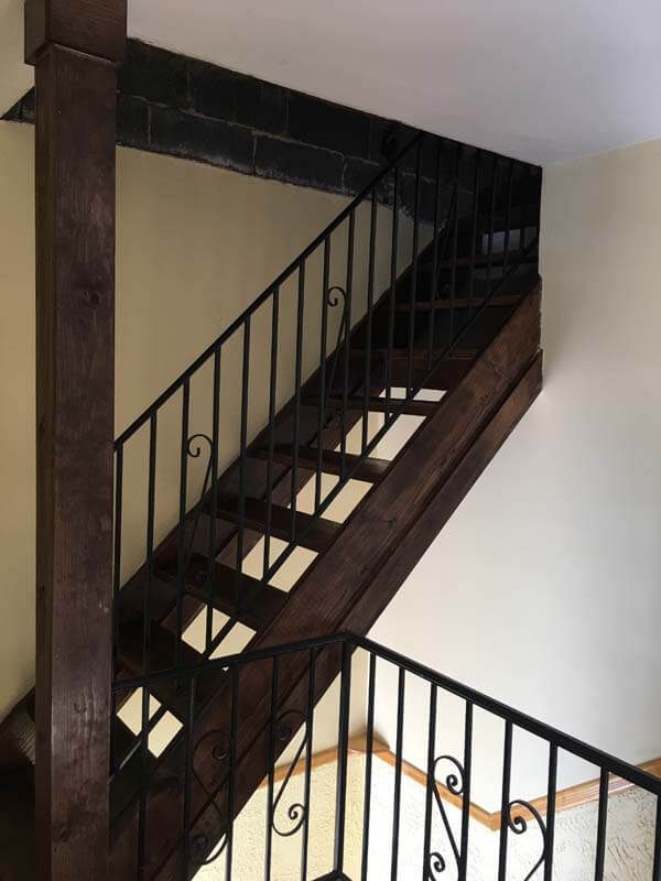 Interior staircase remodel with wrought iron railings — West Babylon, NY