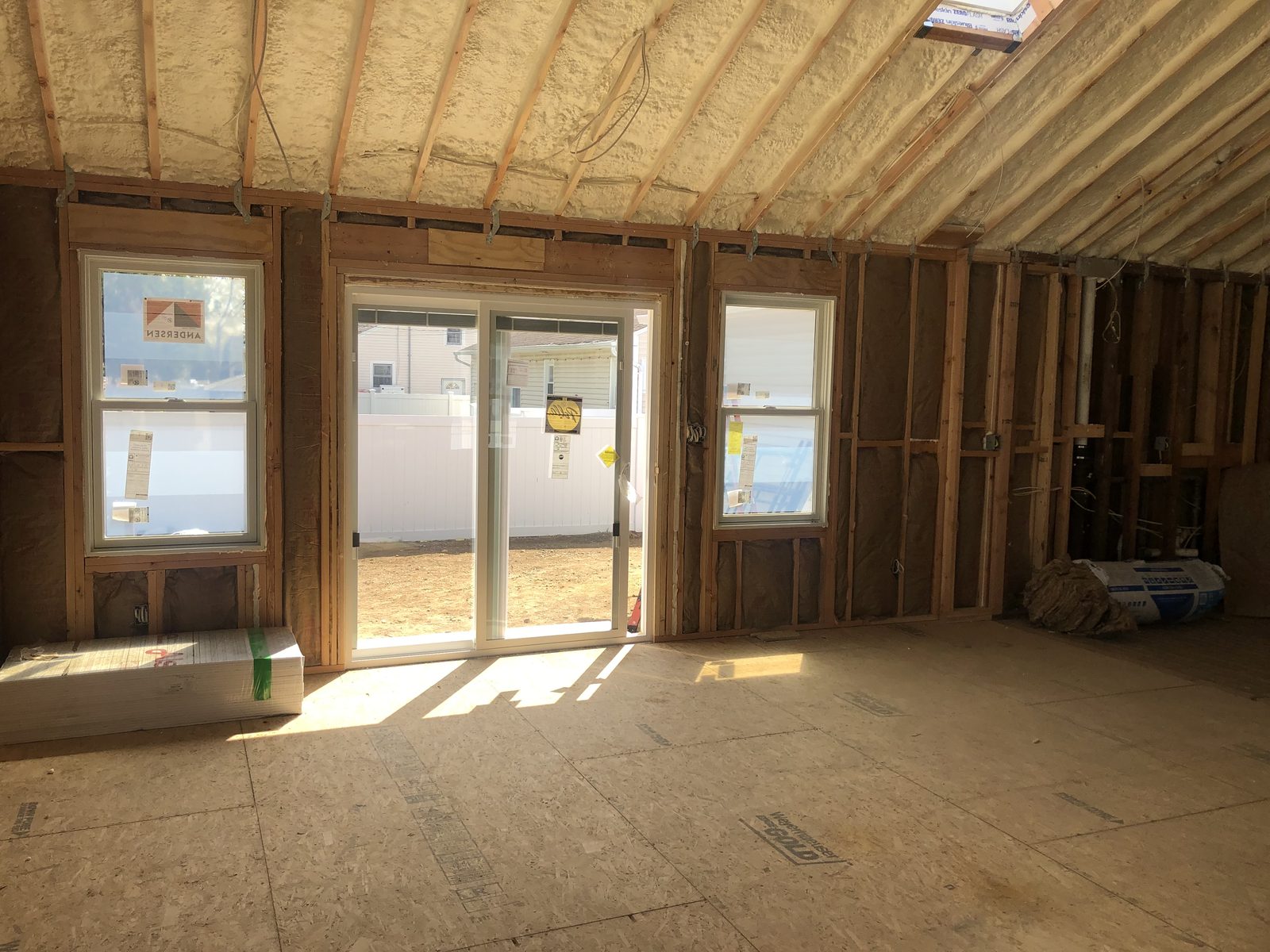 Andersen sliding glass door and double-hung windows, spray foam rafters — Levittown, NY
