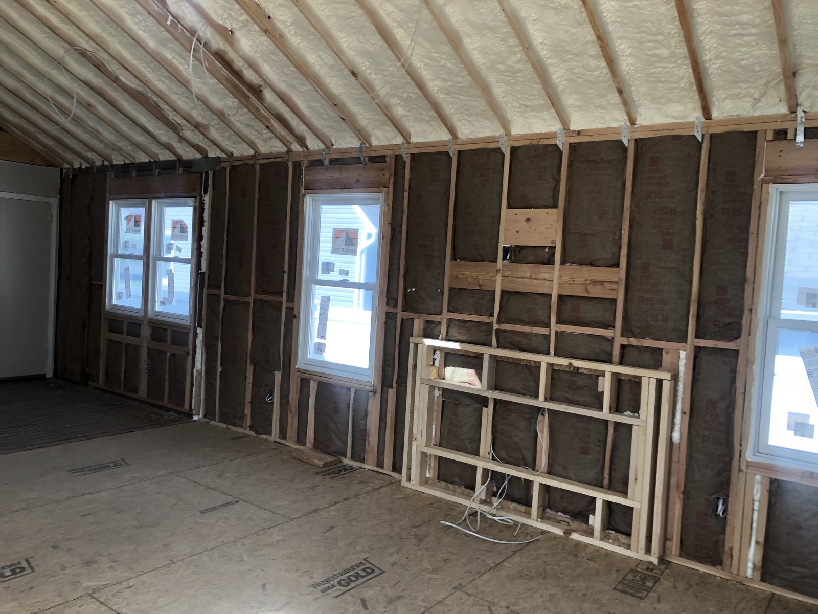 Batt insulation in wall cavities with Andersen windows — Levittown, NY
