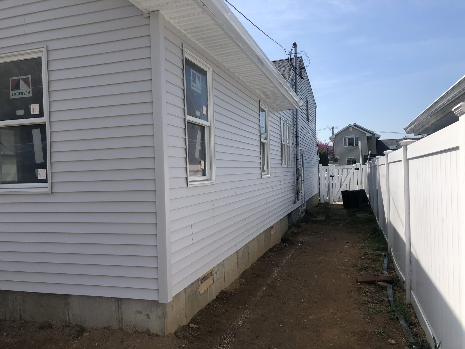 Gray vinyl lap siding installation — Levittown, NY